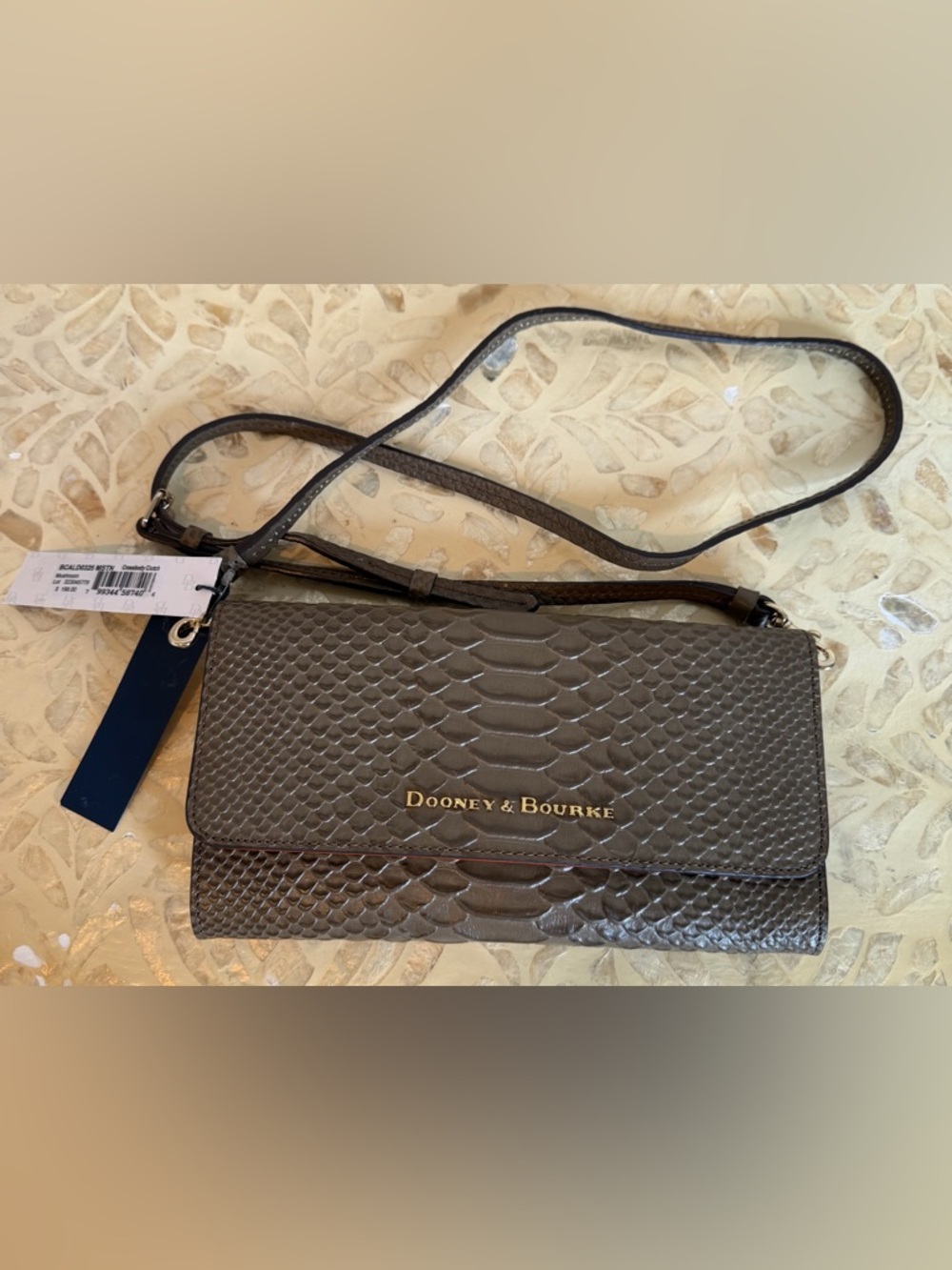 NWT Dooney & Bourke crossbody/clutch in mushroom.